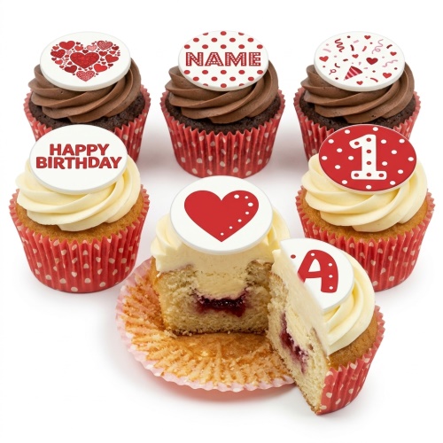 Six cupcakes with red and white heart and polka dot themed edible toppers, some with custom name, age '1', and 'Happy Birthday' messages. One cupcake is cut open showing a jam filling.
