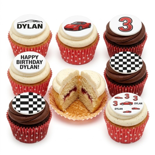 A selection of cupcakes with racing car and checkered flag toppers, some with a custom age and personalised message.
