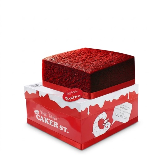 Square red velvet cake with a red ribbon, presented on a Caker Street box.