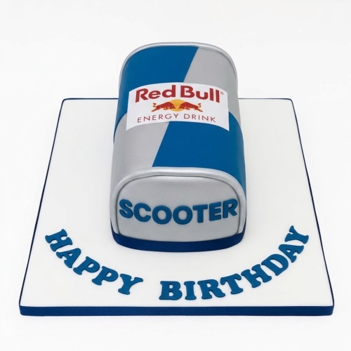 3D sculpted Red Bull energy drink can birthday cake with blue and silver design, on a white board with a custom message.