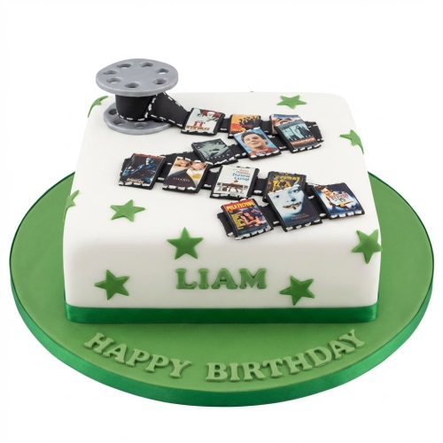 White square birthday cake with green stars, film reel, and movie poster edible decorations.