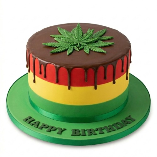 Round reggae themed birthday cake with red, yellow, green layers and a chocolate drip, topped with a green cannabis leaf.