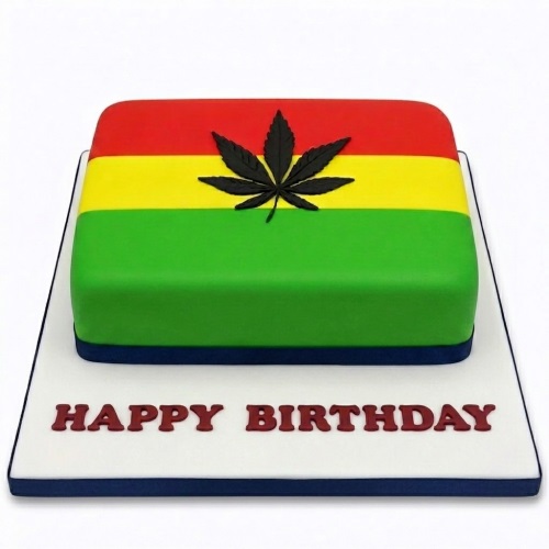 Rectangular cake with red, yellow, green stripes and a black cannabis leaf on top, with 'Happy Birthday' written on the board.