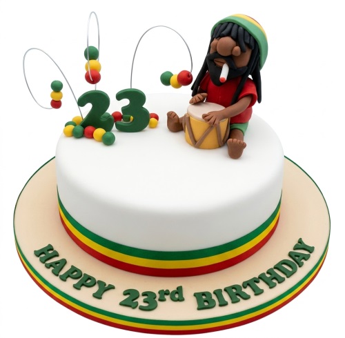 White round cake with Rasta colours, a figure playing a drum, and a custom age topper.