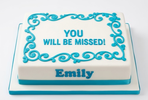Rectangular white farewell cake with turquoise swirl border and custom message.