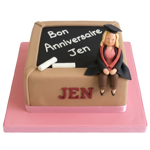 Square graduation cake with a graduate figure, blackboard, and chalk on a pink board.