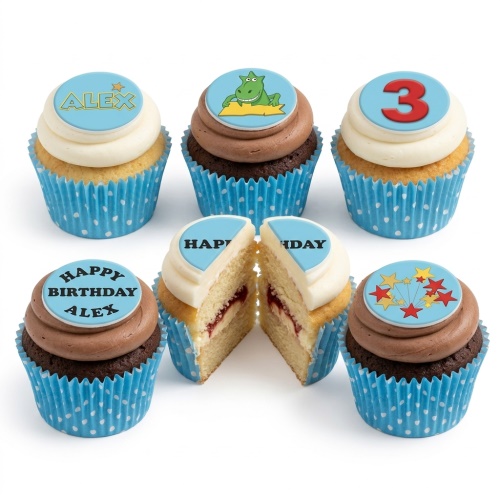 Kids birthday cupcakes with dinosaur, stars, and custom age toppers in blue cases.