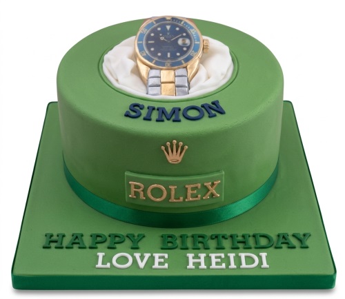 Green birthday cake with an edible gold and silver luxury watch, Rolex logo, and personalised message.