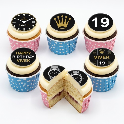 Six cupcakes with white frosting, black and gold Rolex-style watch and crown toppers, some with 'Happy Birthday' and '19'.