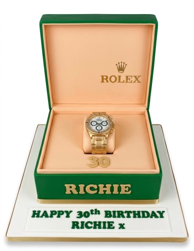 Green and gold watch box cake with an edible gold watch and custom age topper.