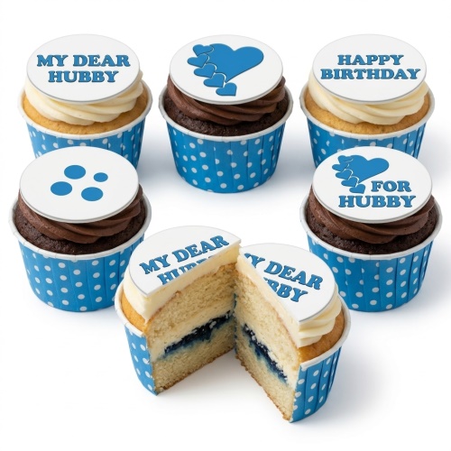 Set of birthday cupcakes for him with white and blue toppers, featuring hearts and custom messages like 'MY DEAR HUBBY' and 'HAPPY BIRTHDAY'.