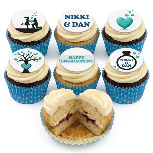 Six engagement themed cupcakes with white frosting, blue polka dot liners, and personalised toppers.