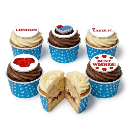 Assortment of London themed cupcakes with vanilla and chocolate frosting, blue polka dot wrappers, and red rose and London toppers.