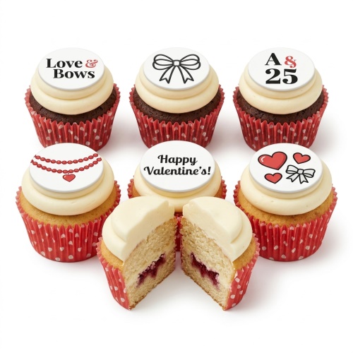Six cupcakes with white frosting, red polka dot cases, and edible toppers featuring hearts, bows, and Valentine's messages.