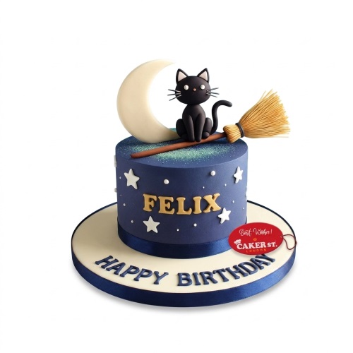 Round blue birthday cake with a black cat, crescent moon, and broomstick.
