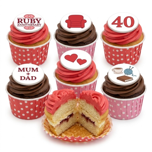 White rectangular anniversary cupcakes with fondant figures of a couple, red hearts, and custom message.