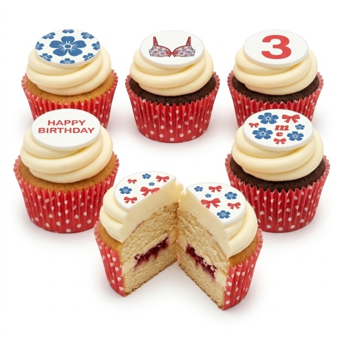 Set of six birthday cupcakes with white frosting, red polka dot wrappers, featuring bra, floral, custom age, and 'Happy Birthday' toppers.