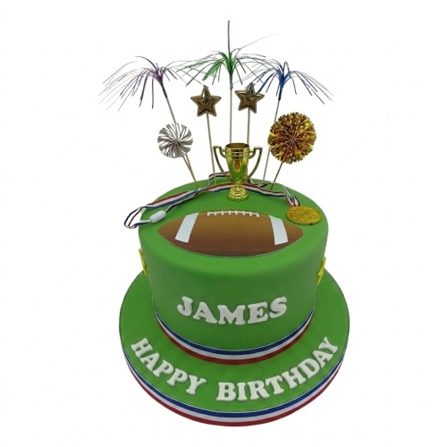 Green American football birthday cake with edible football, gold trophy, medals, and star toppers.