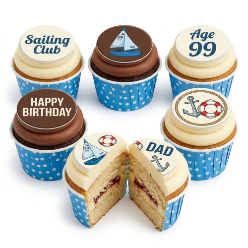 A selection of sailing-themed birthday cupcakes with anchor, sailboat, and lifebuoy toppers, in blue polka dot wrappers.