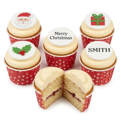 Christmas cupcakes with Santa, holly, gift, and custom message toppers in red polka dot wrappers.
