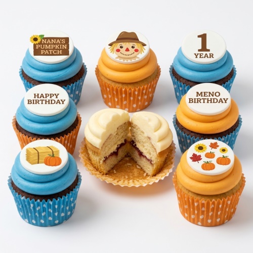 Autumn themed birthday cupcakes with scarecrow, pumpkins, sunflowers, and hay bale toppers.