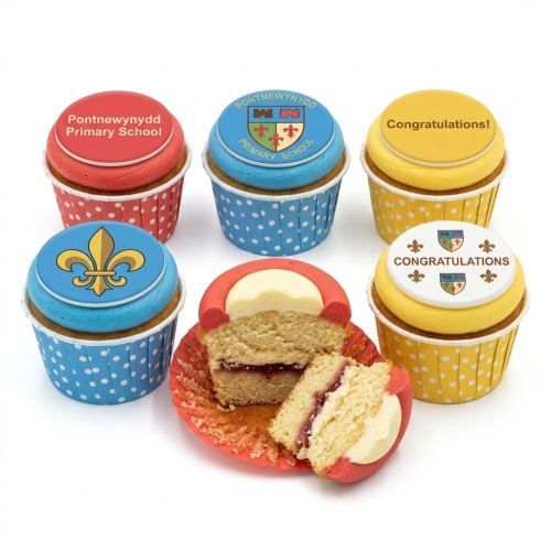 Cupcakes with custom school crests, a fleur-de-lis, and 'Congratulations!' messages on red, blue, and yellow fondant.