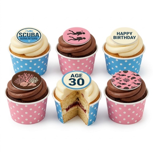 A selection of vanilla and chocolate cupcakes with scuba diving and coral themed edible toppers, some with 'Happy Birthday' and a custom age.