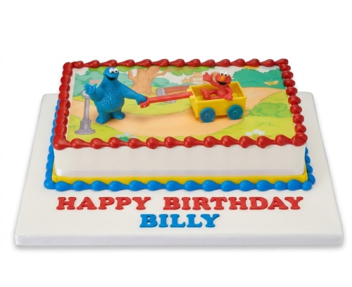 Rectangular kids birthday cake with Cookie Monster and Elmo edible image and custom message.