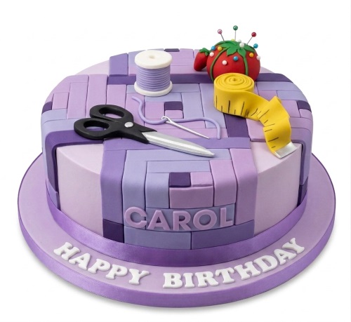 Round purple patchwork cake with edible sewing scissors, thread, needle, pincushion, and measuring tape decorations.