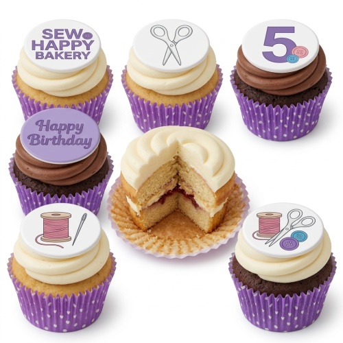 A selection of sewing themed cupcakes with white and chocolate frosting, decorated with edible toppers featuring scissors, a spool of thread, and buttons, alongside a custom age '5' topper and a 'Happy Birthday' message.