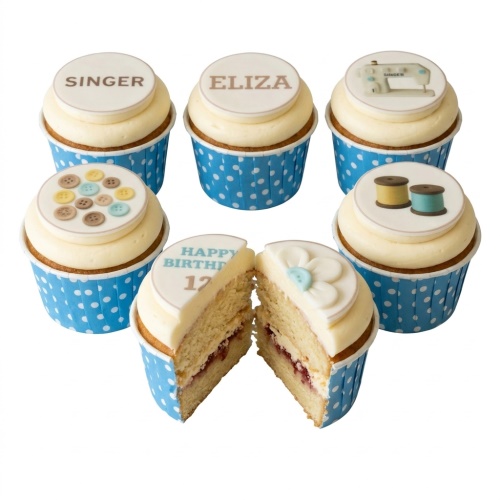 Cupcakes with sewing machine, buttons, thread spools, and custom age topper.
