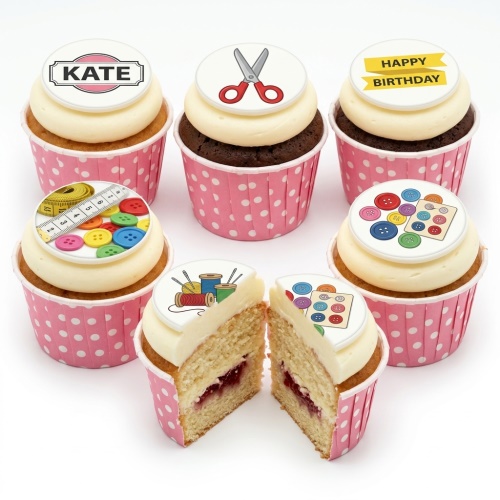 A selection of sewing theme cupcakes with edible toppers featuring scissors, buttons, measuring tape, and thread spools.