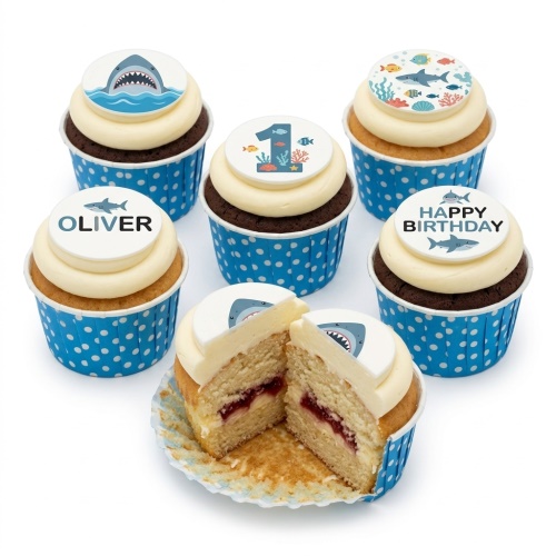 Shark themed birthday cupcakes with blue polka dot cases and customisable edible toppers.