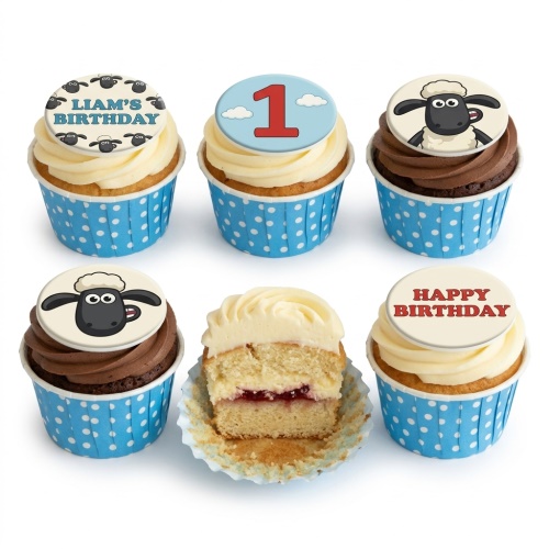 Shaun the Sheep themed birthday cupcakes with custom age and name toppers, in blue polka dot wrappers.