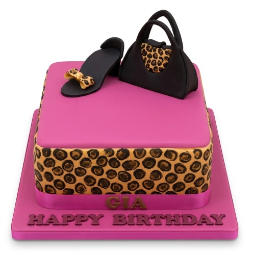 Square pink cake with leopard print, black high heel shoe, and black handbag decorations.
