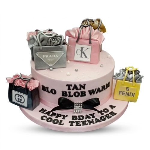 Pink birthday cake with edible designer shopping bags and a custom message.