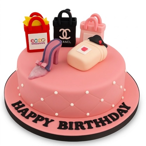 Pink fashion theme birthday cake with designer-inspired shopping bags, high heel shoe, and perfume bottle.