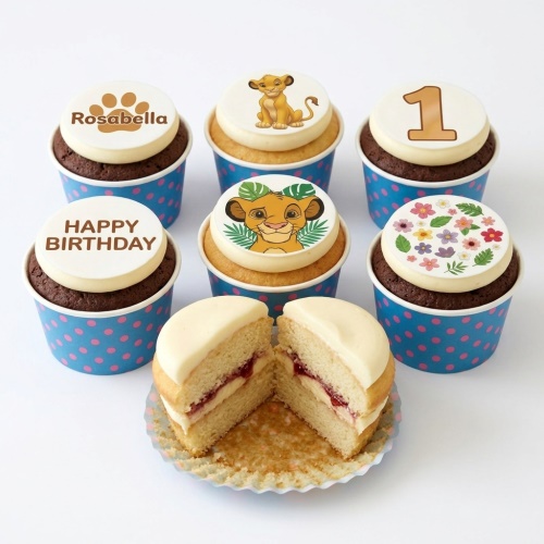 Lion King themed cupcakes featuring Simba, paw print, and floral toppers, with examples of custom age and message.