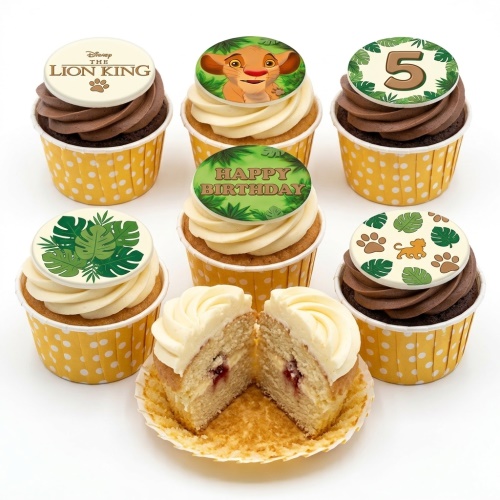 A set of The Lion King themed cupcakes with Simba, logo, jungle leaves, and a custom age topper.