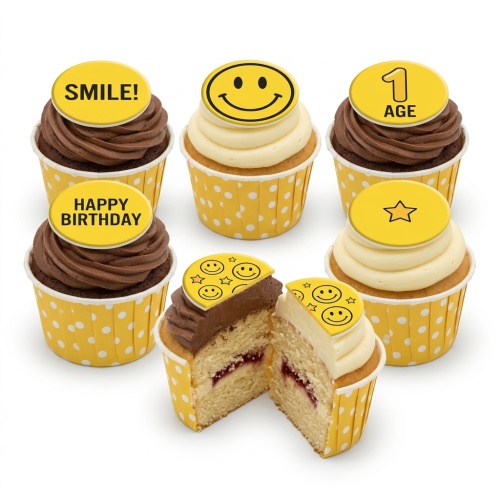 A selection of smiley face birthday cupcakes with yellow polka dot wrappers and custom age and message toppers.