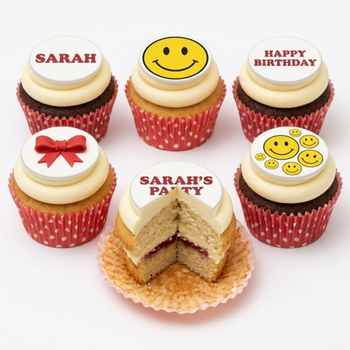 Assortment of vanilla and chocolate cupcakes with white buttercream and smiley face and red bow fondant toppers.