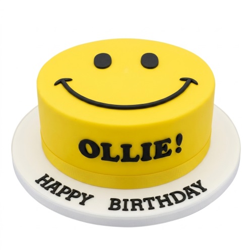Round yellow birthday cake with a black smiley face design and space for a custom name.