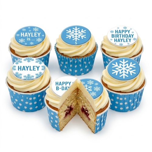 Blue and white snowflake themed birthday cupcakes with custom age and personalised messages.