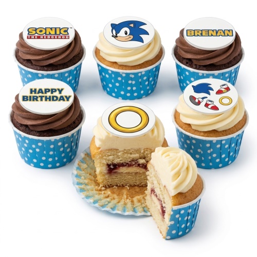 A selection of Sonic the Hedgehog themed cupcakes with various edible toppers, including Sonic's face, logo, rings, and custom message examples.