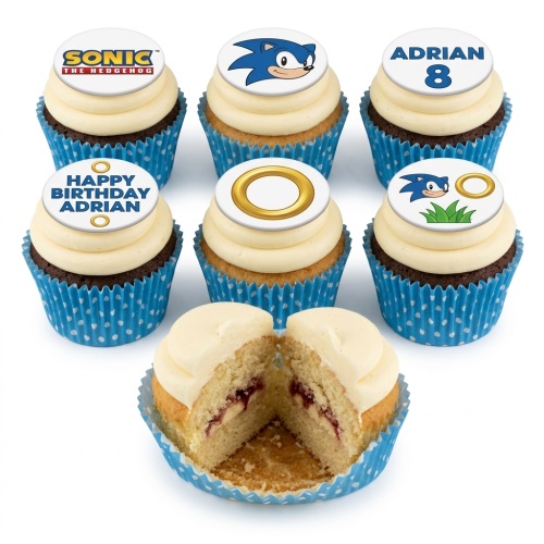 Sonic the Hedgehog themed cupcakes with character, logo, and ring toppers, blue cases.