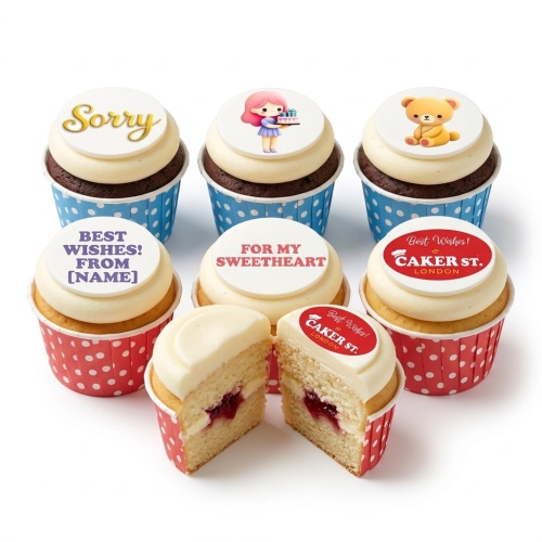 A selection of personalised message cupcakes with various edible toppers including "Sorry", a girl with presents, and a teddy bear.