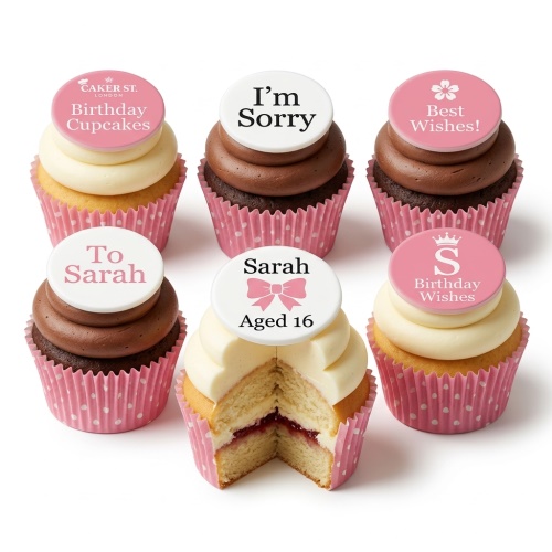 Six cupcakes with pink and white frosting, pink polka dot wrappers, and custom message toppers.