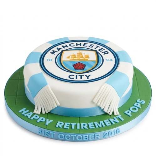 Round white cake with Manchester City FC logo and blue and white striped scarf, on a green board with a custom message.