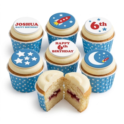 Vanilla cupcakes with blue and white rocket and star themed edible toppers for a birthday.