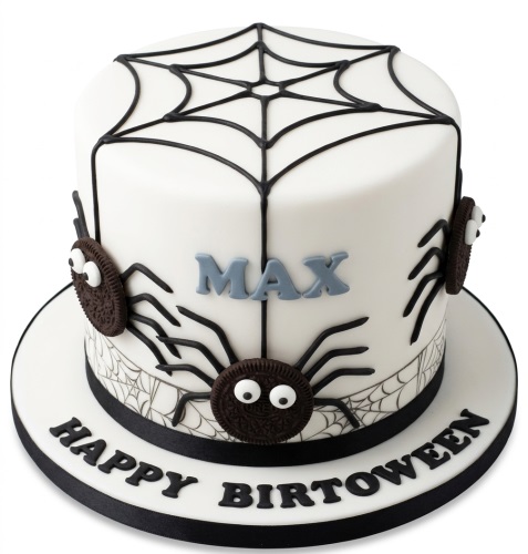 White round cake with black spiderweb design and edible cookie spiders, personalised with a name.